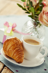 Romantic breakfast with coffee and croissant
