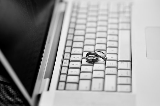 wedding rings on the lap top