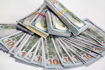 Dollars in packs on a white table