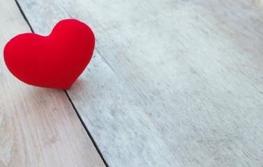 red heart on wood background