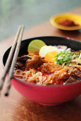 close up thai northern spicy pork noodle in cup