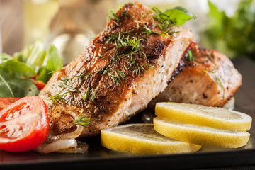Fried salmon steak with vegetables