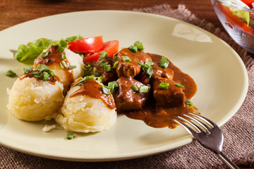 Goulash with boiled potatoes