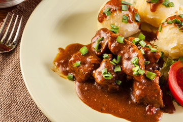 Goulash with boiled potatoes
