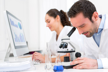 Scientist and her assistant in a laboratory