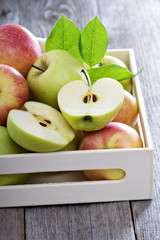 Fresh apples in a wooden box