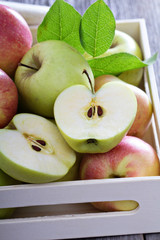 Fresh apples in a wooden box