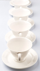 Fototapeta na wymiar Ceramic saucer and teacup over white background 