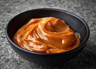 Bowl of melted caramel cream