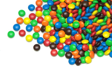 Colorful dragee candies on white background.