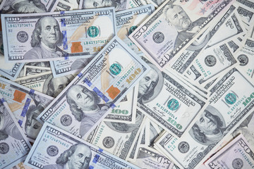 money in a chaotic manner on the floor