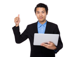 Fototapeta na wymiar Businessman use of laptop and thumb up