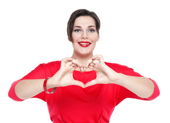 Beautiful plus size woman doing heart shape with her hands. Focu