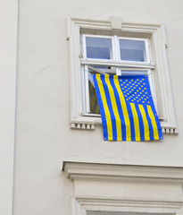 Fototapeta premium color flag be suspended at window