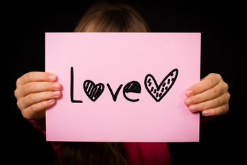 Child holding Love sign