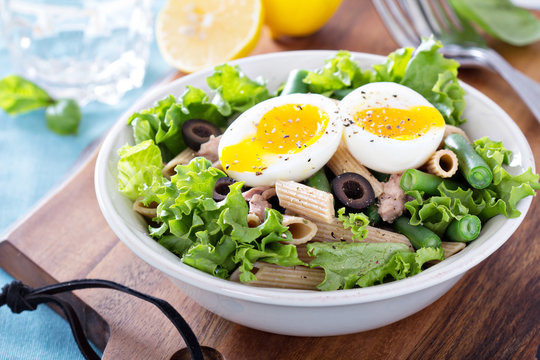 Salad with greens, pasta, tuna and egg