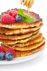 Pancakes with raspberry, blueberry, mint and honey syrup