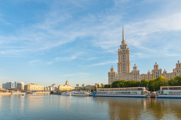 Fototapeta na wymiar House with a spire Soviet times on Moskva River embankment