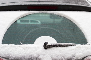 wiper on the car snowy window - obrazy, fototapety, plakaty