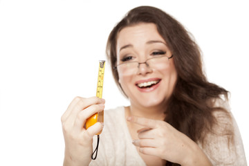 women laughed at the size shown on the measuring tape