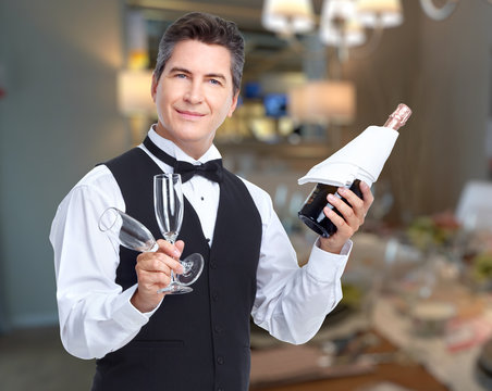 Waiter with wine and wineglasses