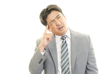 頭痛を訴えるビジネスマン