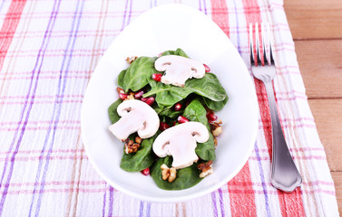 Fresh salad with greens, garnet and spices