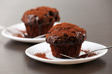 Yummy chocolate cupcake on table