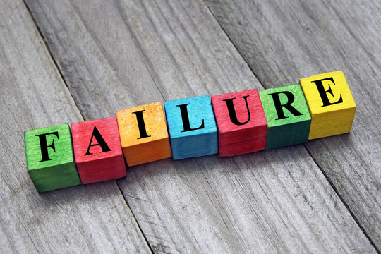 word failure on colorful wooden cubes