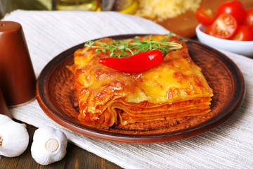 Portion of tasty lasagna on table