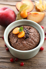Hot chocolate pudding with fondant centre on table, close-up
