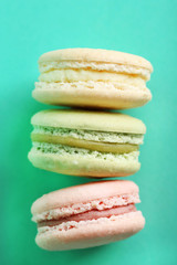 Gentle colorful macaroons on color background