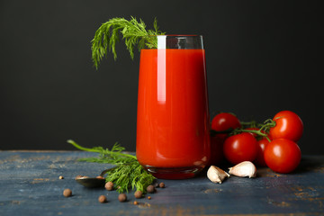 Glass of tasty tomato juice and fresh tomatoes