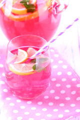 Pink lemonade in glasses on table close-up