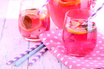 Pink lemonade in glasses on table close-up
