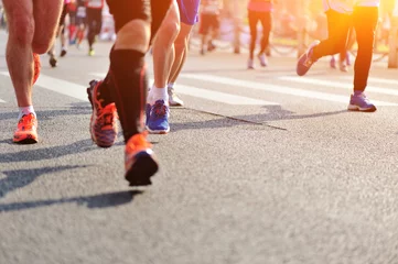 Photo sur Aluminium Jogging  marathon athletes legs running on city road
