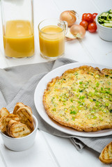 Omelette with zucchini and mozzarella cheese, scallions