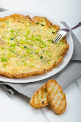 Omelette with zucchini and mozzarella cheese, scallions