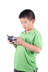 Boy holding a radio remote control for helicopter, drone, plane