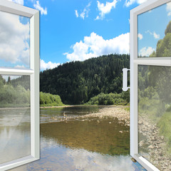 window opened to the river and mountains