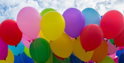 A colorful flying balloon in blue sky