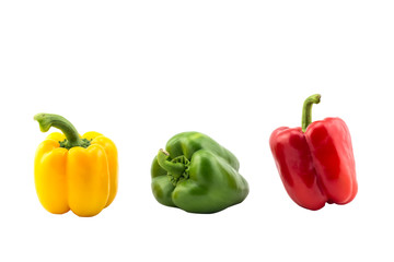 three bell peppers yellow green red isolated on white background