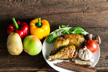 Roasted chicken wooden table.