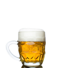 Mug full of fresh beer isolated on white background