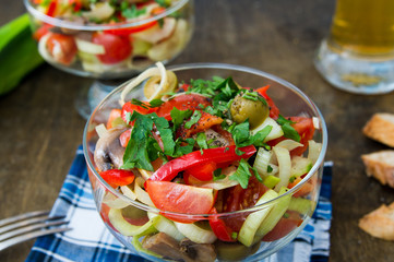 Italian salad with cherry tomatoes, mushrooms, sweet peppers and