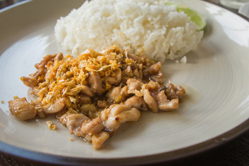 Rice with chicken fried with garlic and black pepper