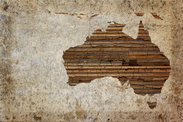 Grunge vintage wooden plank Australia map background.