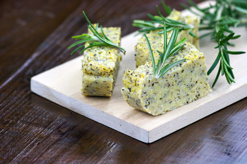 Baked polenta with italian cheese and rosemary