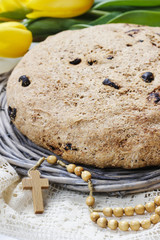 Festive easter bread, beautiful yellow tulips and easter eggs