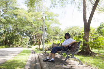 Girl sitting on the bench.